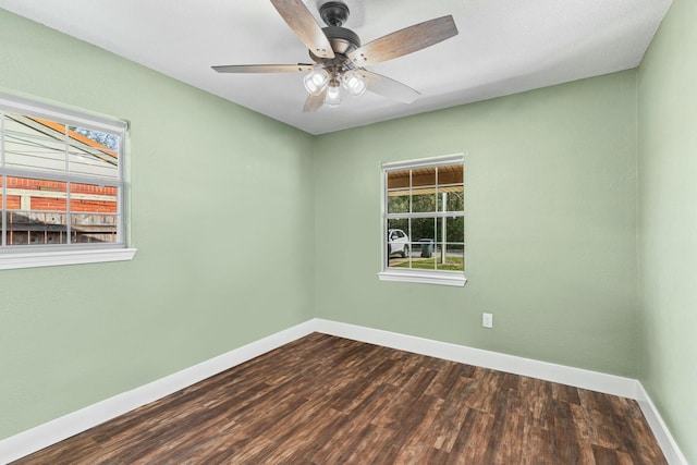 spare room featuring ceiling fan, wood finished floors, and baseboards