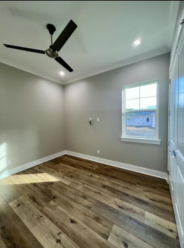 spare room featuring ceiling fan, crown molding, and hardwood / wood-style floors