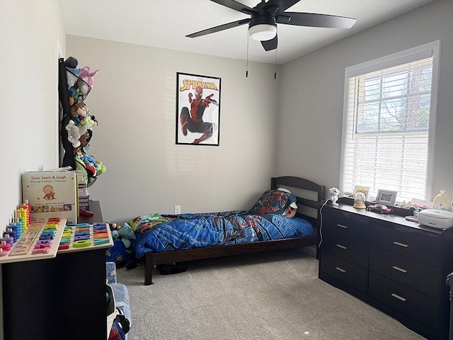 carpeted bedroom with ceiling fan