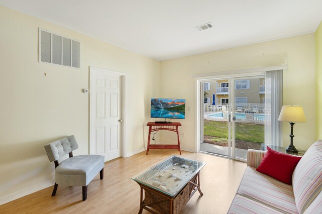 sitting room featuring light hardwood / wood-style floors