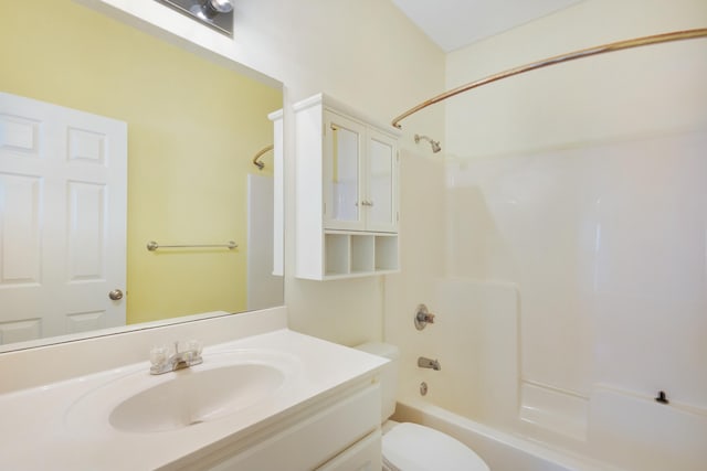 full bathroom with vanity, shower / bathtub combination, and toilet
