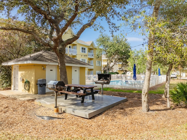 view of community with a pool side deck