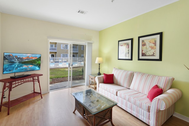 living room with light hardwood / wood-style flooring