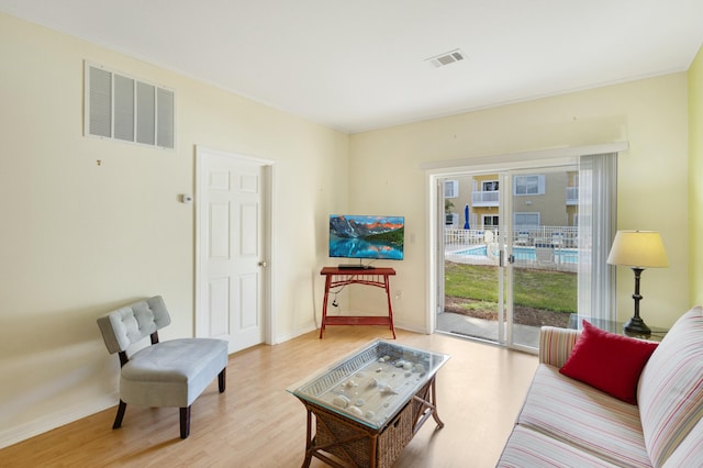 sitting room with light hardwood / wood-style floors