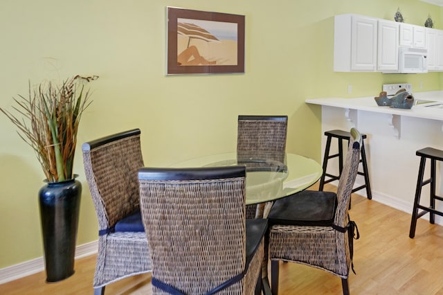 dining room featuring light hardwood / wood-style floors