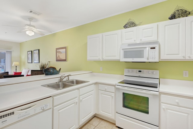 kitchen with white appliances, white cabinets, ceiling fan, light tile patterned floors, and sink