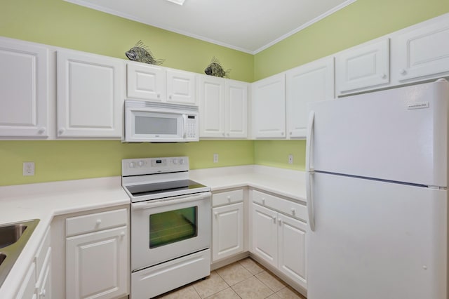 kitchen with sink, white appliances, white cabinets, crown molding, and light tile patterned flooring