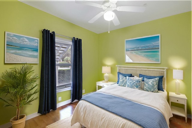 bedroom with ceiling fan and hardwood / wood-style floors