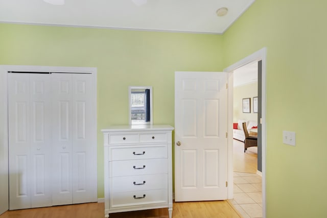 unfurnished bedroom with light hardwood / wood-style floors and a closet