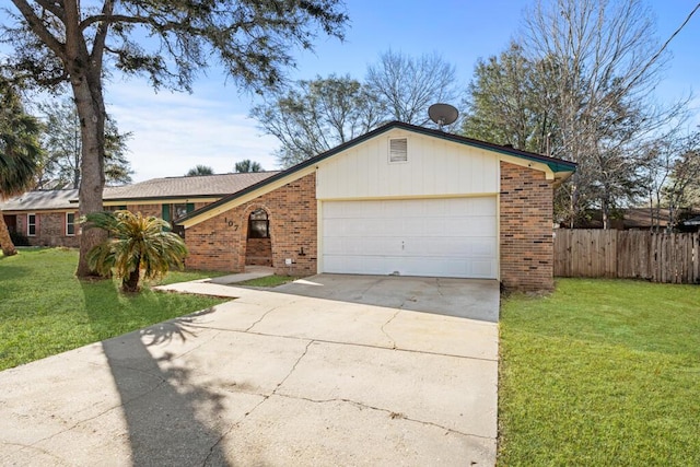 single story home featuring a front lawn and a garage