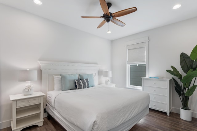 bedroom featuring ceiling fan, baseboards, dark wood-type flooring, and recessed lighting