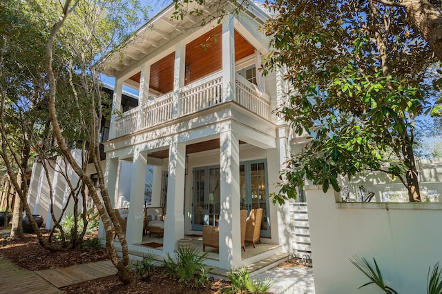 exterior space featuring fence and a balcony