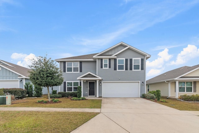 view of front of house with a front lawn and a garage