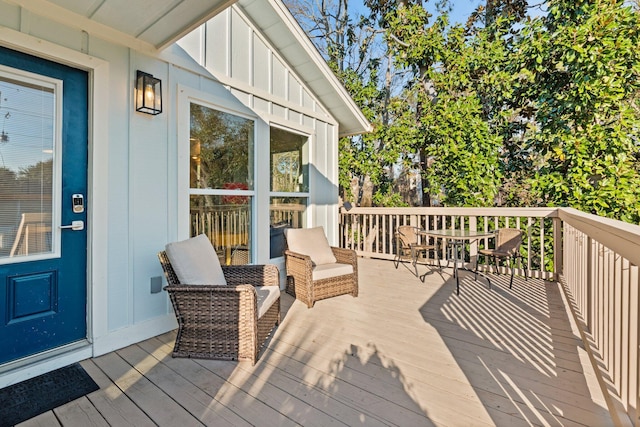 wooden deck with outdoor dining space