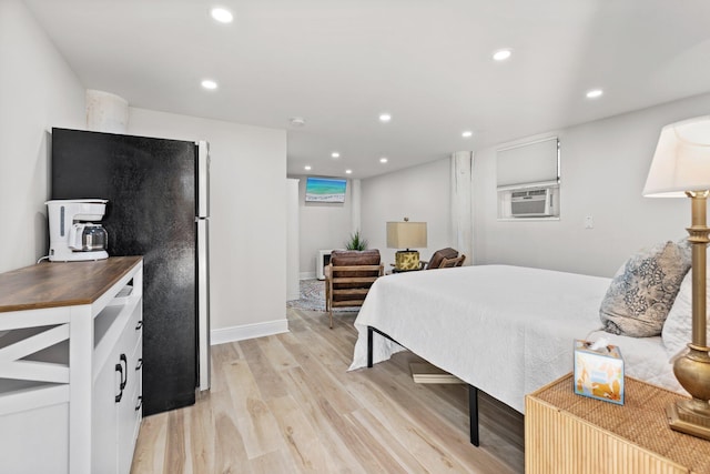 bedroom featuring recessed lighting, baseboards, cooling unit, and light wood finished floors