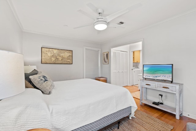 bedroom featuring visible vents, a ceiling fan, connected bathroom, light wood-style flooring, and ornamental molding