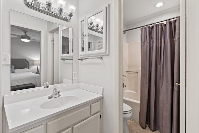 ensuite bathroom featuring toilet, shower / tub combo, connected bathroom, vanity, and ceiling fan