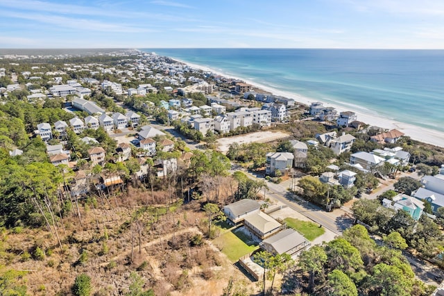 aerial view featuring a residential view, a water view, and a beach view