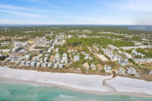 drone / aerial view with a water view and a view of the beach