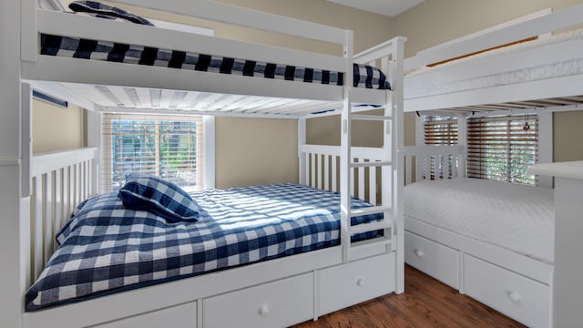 bedroom with dark wood-style floors