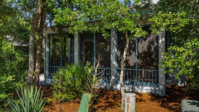 view of yard featuring a sunroom