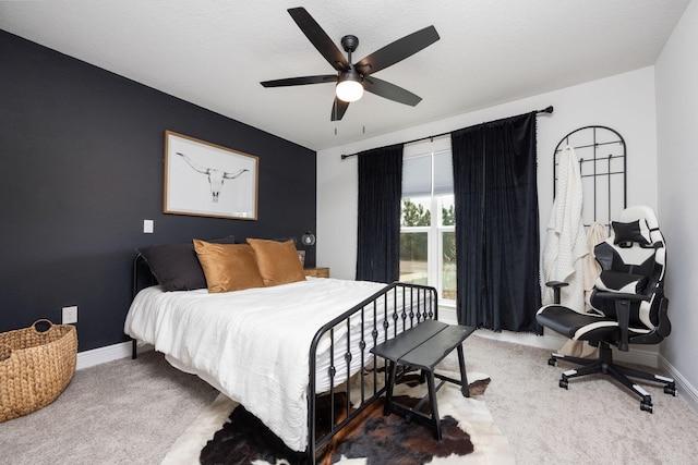 carpeted bedroom featuring ceiling fan and baseboards