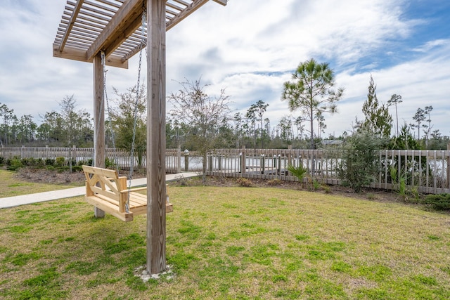 view of yard with fence and a pergola