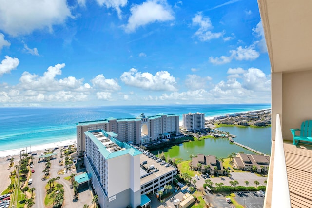 drone / aerial view featuring a water view and a beach view