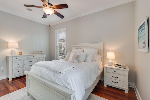 bedroom featuring dark wood-style flooring, crown molding, baseboards, and ceiling fan