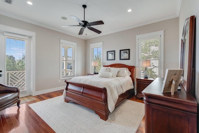 bedroom featuring access to exterior, multiple windows, and crown molding