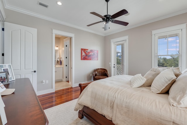 bedroom with baseboards, light wood-style flooring, visible vents, and crown molding