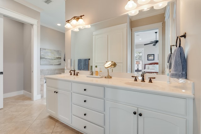 ensuite bathroom with ensuite bath, ornamental molding, a sink, and tile patterned floors