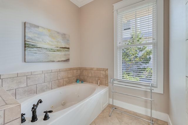 bathroom with baseboards, a jetted tub, and tile patterned floors