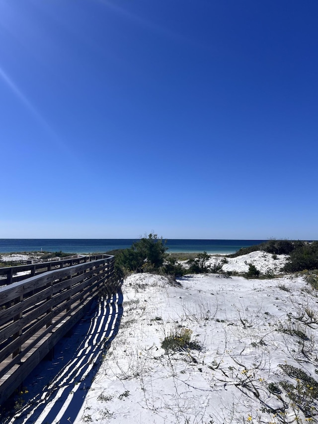 property view of water featuring a beach view