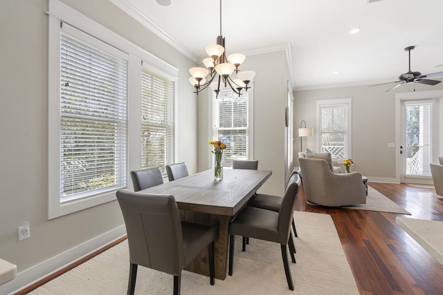 dining space with crown molding, baseboards, dark wood-style flooring, and recessed lighting