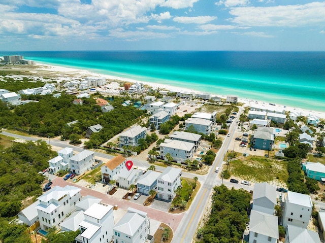 drone / aerial view with a water view and a view of the beach