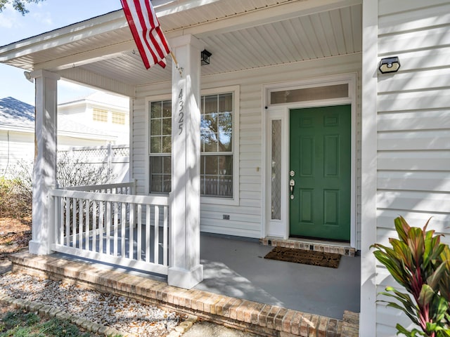 doorway to property featuring a porch