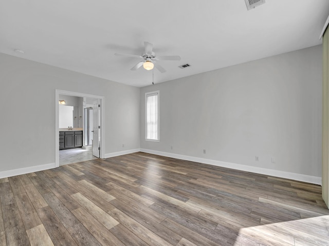 empty room featuring ceiling fan and wood-type flooring