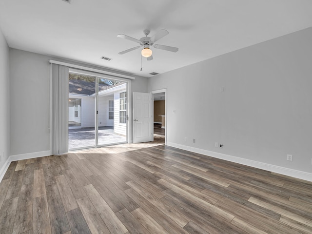 unfurnished room featuring hardwood / wood-style floors and ceiling fan