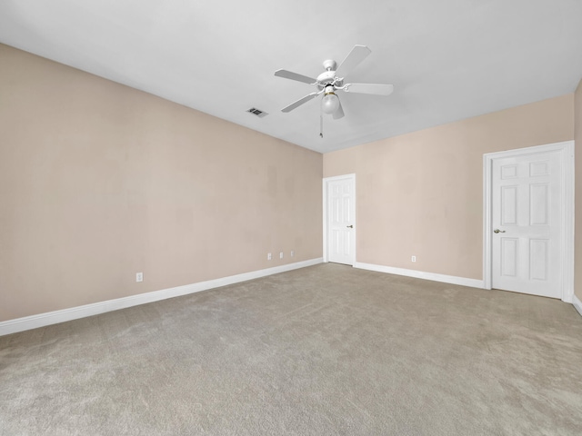 carpeted empty room with ceiling fan