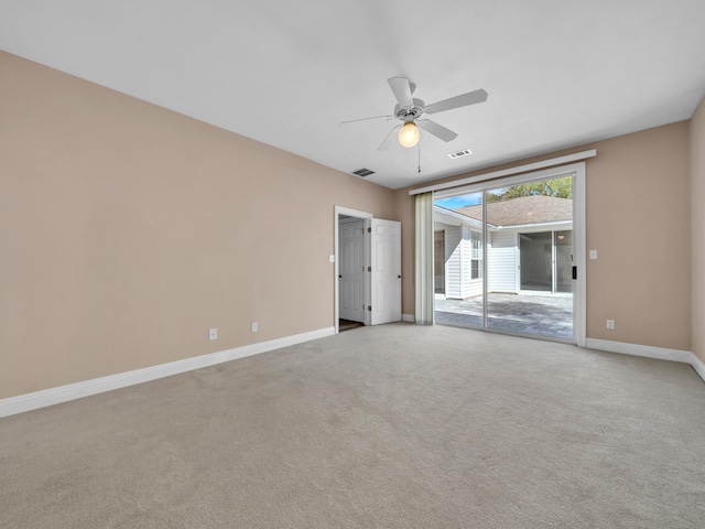 empty room featuring light carpet and ceiling fan