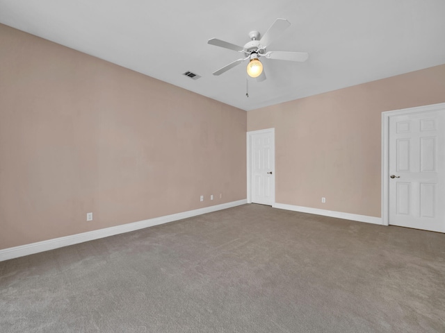 spare room with carpet floors and ceiling fan