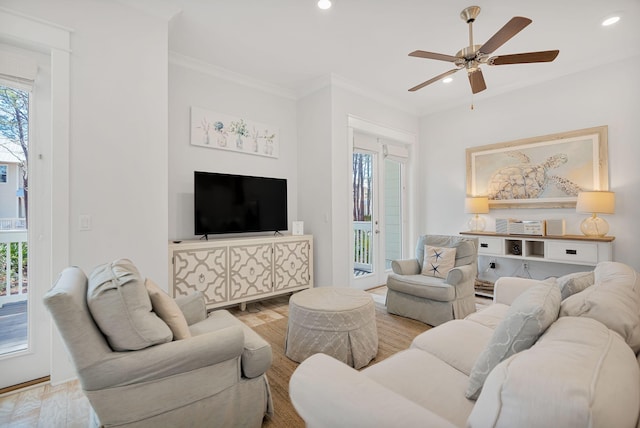 living room with ceiling fan, ornamental molding, light wood-style flooring, and recessed lighting