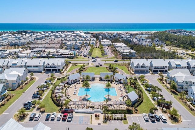 drone / aerial view with a water view and a residential view