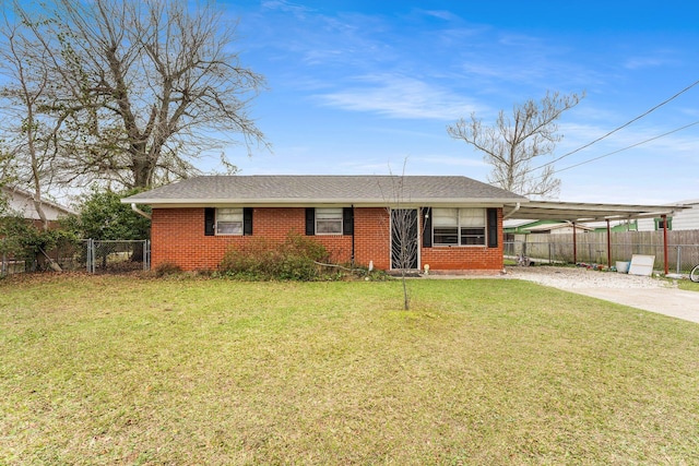 view of front facade featuring a front lawn and a carport