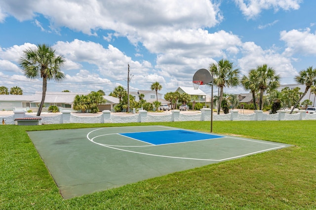 view of sport court featuring a yard, a residential view, and community basketball court