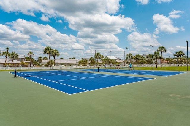 view of sport court with fence