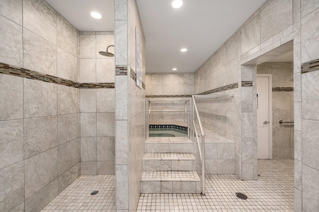 bathroom featuring tiled shower and recessed lighting