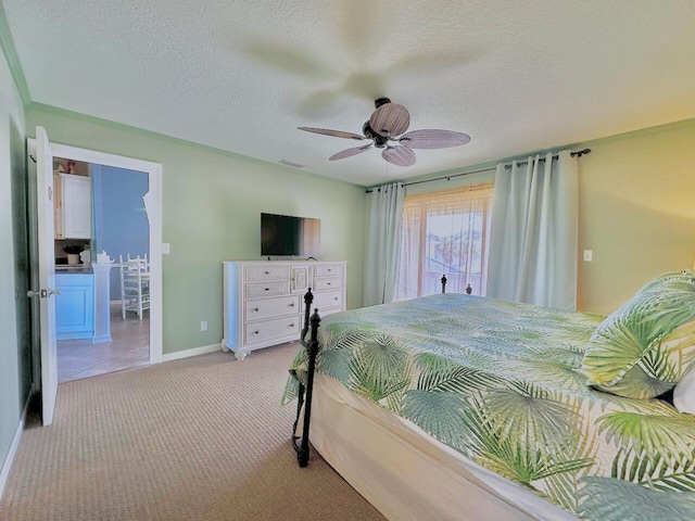 bedroom with light carpet, a textured ceiling, a ceiling fan, and baseboards