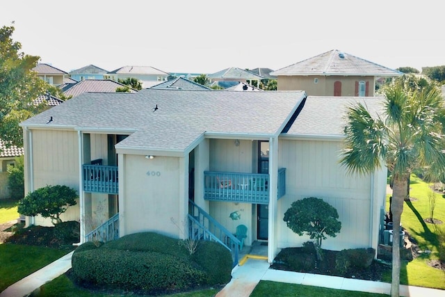 view of front of home with a shingled roof